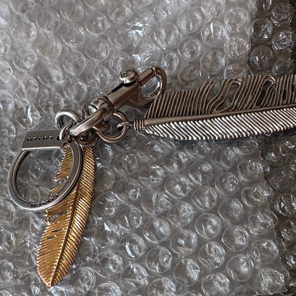 Coach RARE  Metallic Feather Keychain - Picture 8 of 8